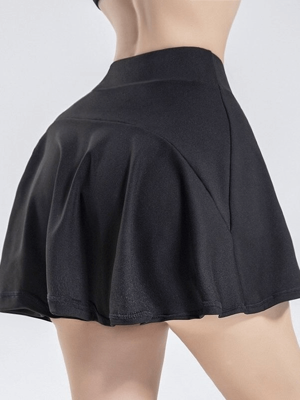 Stylish elastic women's tennis shorts-skirt with pocket in black, designed for comfort and performance on the court.